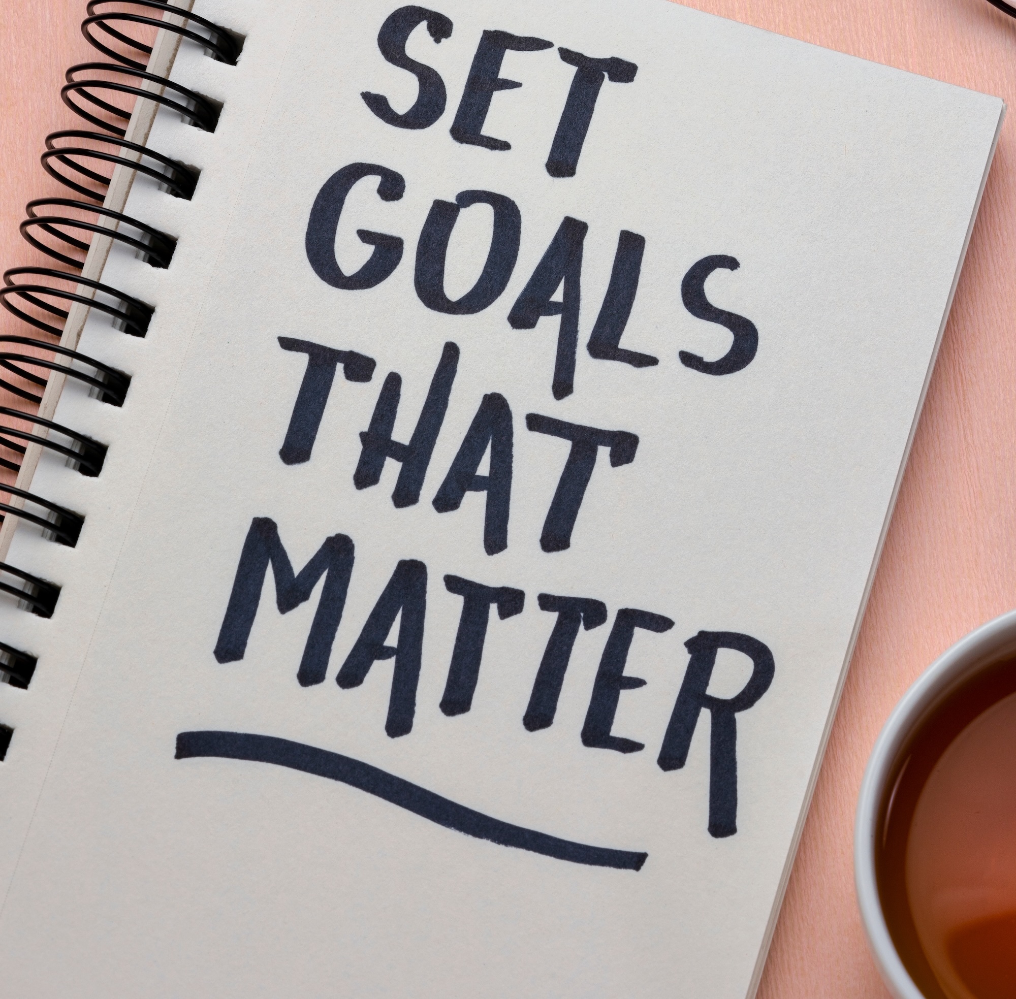 Set goals that matter  inspirational advice or reminder - handwriting in a notebook, smart goals setting concept